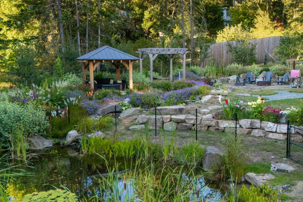 Aerial view of a pond, gazebo and pergola garden